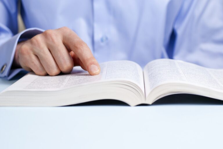 hand and a book