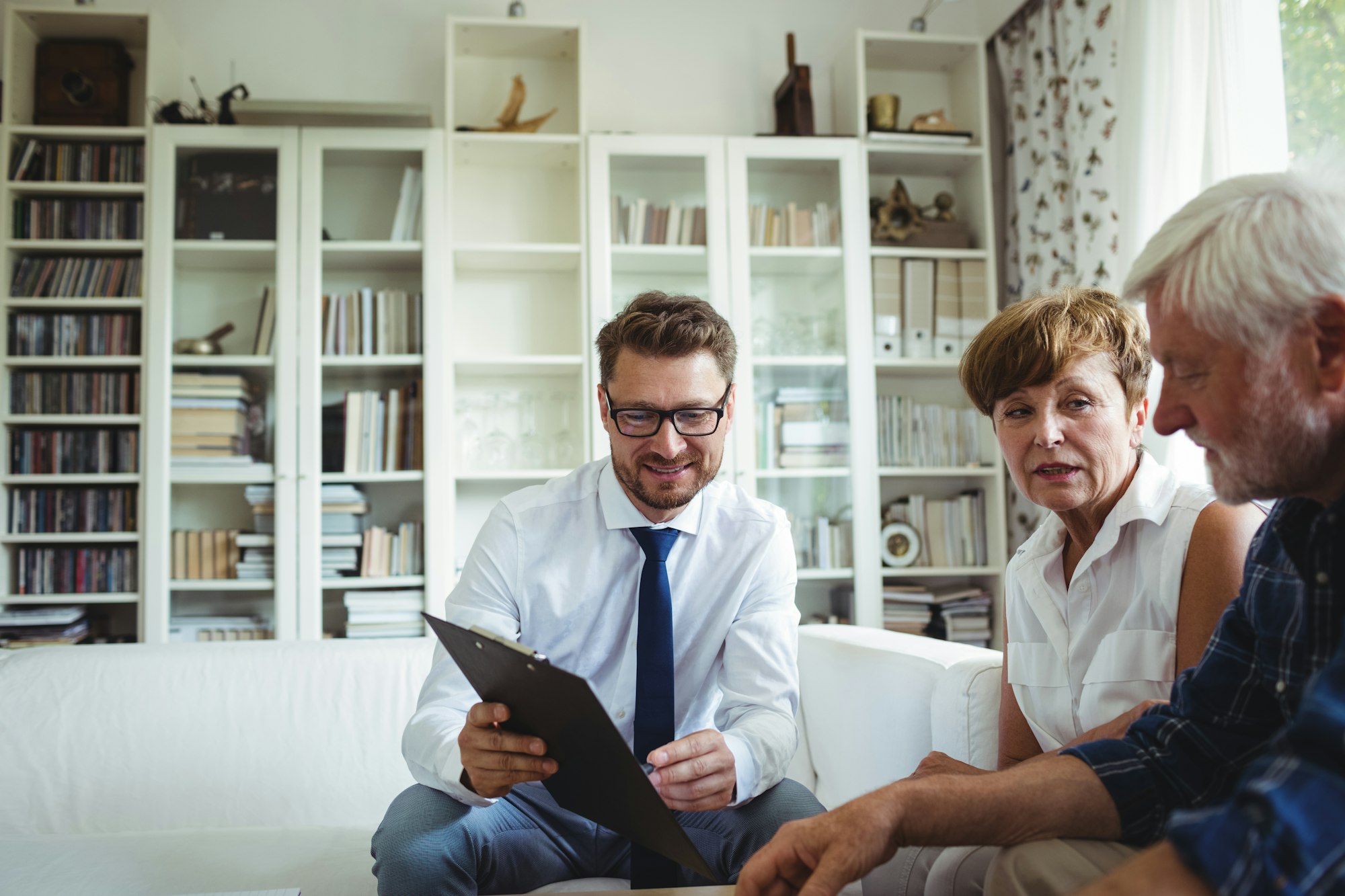 Senior couple planning their investments with financial advisor